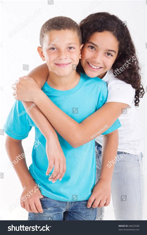 Portrait Of Young Sister And Brother In Studio High Res Stock Photo Portrait Of Young Sister And Brother In Studio High Res Stock Photo