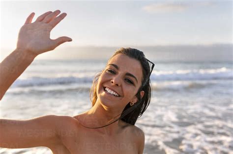 Spain Asturias Beautiful Young Woman On The Beach At Sunset Stock Spain Asturias Beautiful Young Woman On The Beach At Sunset Stock